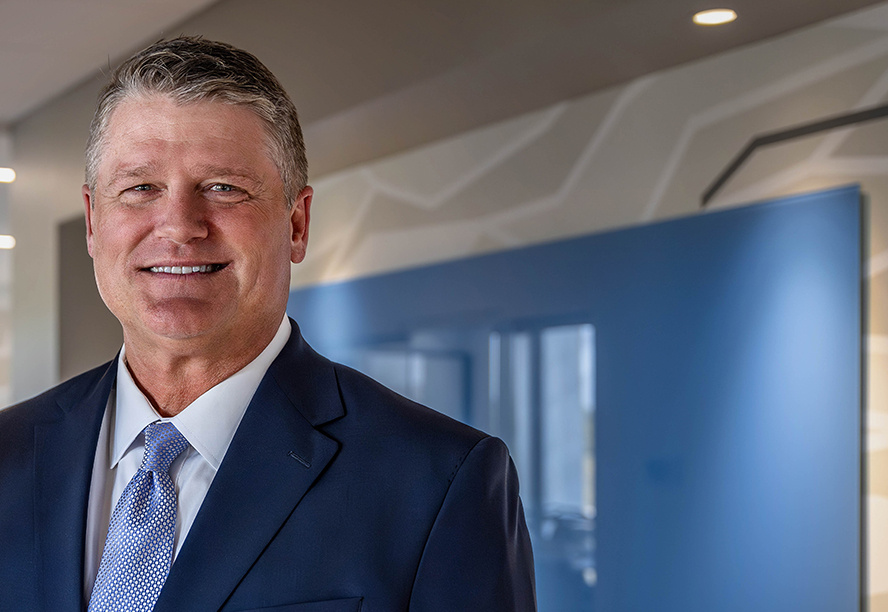 Standing Headshot of CEO Monte McNew About Community State Bank